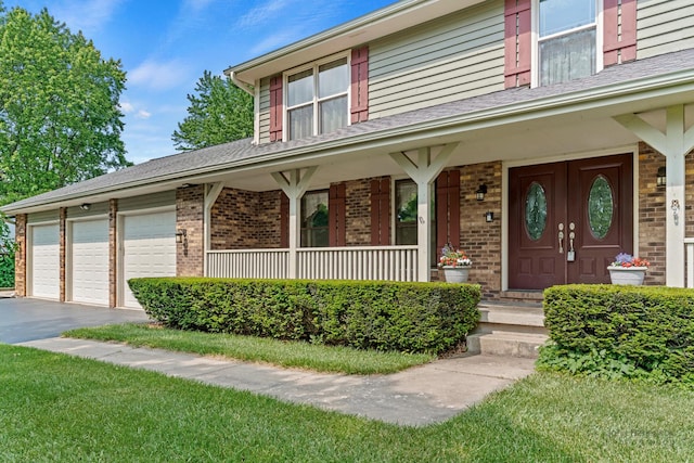 19N050 Felsmith Rd, Hampshire, IL 60140 - view of front of property with a porch, brick siding, and driveway