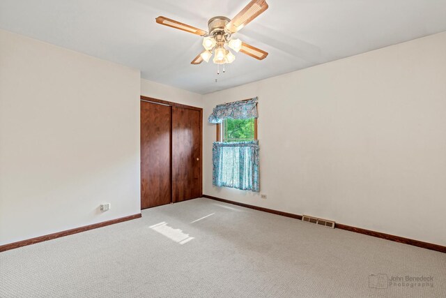19N050 Felsmith Rd, Hampshire, IL 60140 - unfurnished bedroom with light colored carpet, a closet, and a ceiling fan