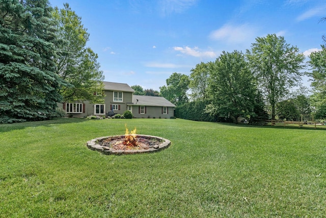 19N050 Felsmith Rd, Hampshire, IL 60140 - view of grassy yard featuring an outdoor fire pit