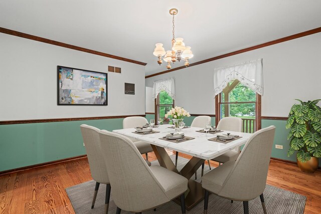 19N050 Felsmith Rd, Hampshire, IL 60140 - dining area featuring a chandelier, crown molding, healthy amount of natural light, and wood finished floors