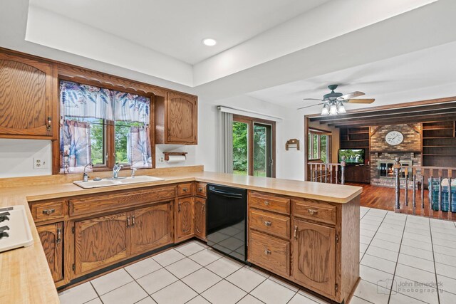 19N050 Felsmith Rd, Hampshire, IL 60140 - kitchen with dishwasher, a peninsula, light tile patterned floors, and light countertops
