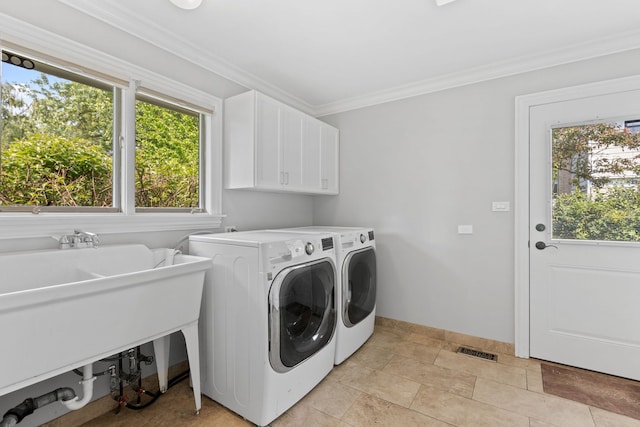 2510 Marian Ln, Wilmette, IL 60091 - laundry area with cabinet space, washing machine and dryer, plenty of natural light, ornamental molding, and baseboards