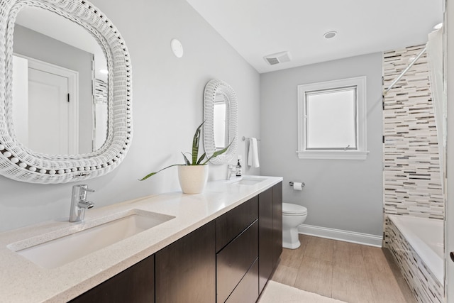 2510 Marian Ln, Wilmette, IL 60091 - full bathroom with double vanity, baseboards, toilet, and recessed lighting