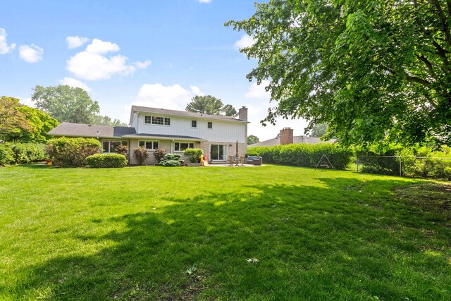 2510 Marian Ln, Wilmette, IL 60091 - back of house with a chimney, a patio area, and brick siding
