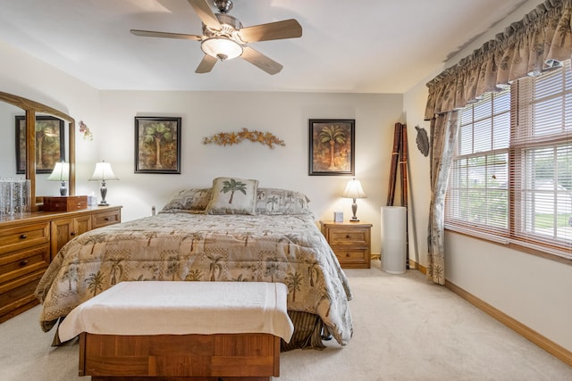 1912 Oak Park Dr, Champaign, IL 61822 - bedroom featuring light carpet, baseboards, and a ceiling fan