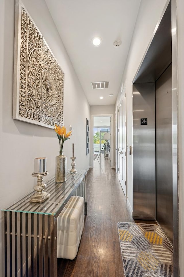 919 N Larrabee St Unit 3N, Chicago, IL 60610 - hall with elevator, wood finished floors, and recessed lighting