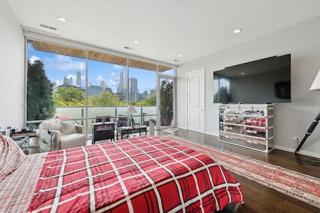 919 N Larrabee St Unit 3N, Chicago, IL 60610 - bedroom featuring floor to ceiling windows, wood finished floors, recessed lighting, and baseboards