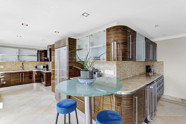111 E Chestnut St Unit 24C, Chicago, IL 60611 - kitchen featuring appliances with stainless steel finishes, light tile patterned floors, a sink, open shelves, and light countertops