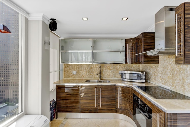 111 E Chestnut St Unit 24C, Chicago, IL 60611 - kitchen featuring black appliances, wall chimney exhaust hood, a sink, modern cabinets, and tasteful backsplash