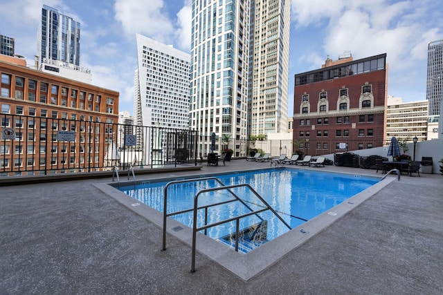111 E Chestnut St Unit 24C, Chicago, IL 60611 - community pool featuring a view of city and a patio area