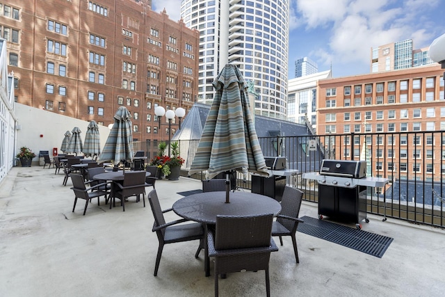 111 E Chestnut St Unit 24C, Chicago, IL 60611 - view of patio with grilling area, a city view, and outdoor dining area