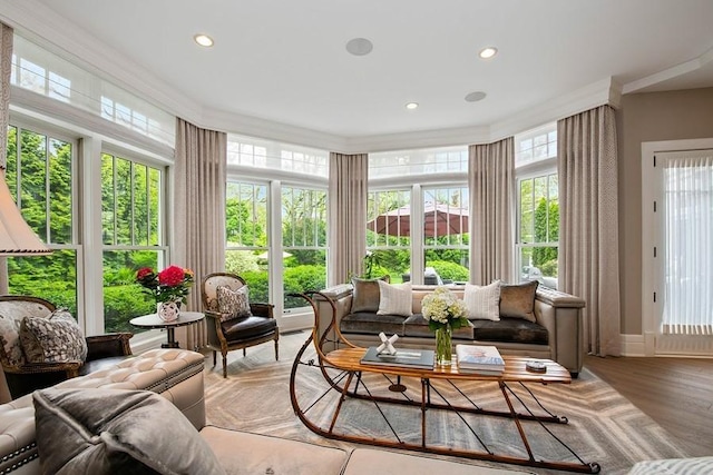 sunroom with recessed lighting, crown molding, and wood finished floors
