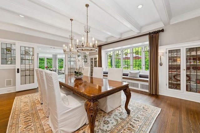 dining space featuring beam ceiling, a chandelier, ornamental molding, plenty of natural light, and dark wood-style flooring