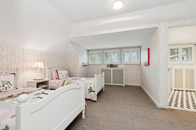 carpeted bedroom featuring wallpapered walls and multiple windows
