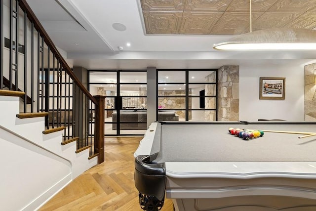 playroom featuring a raised ceiling and recessed lighting