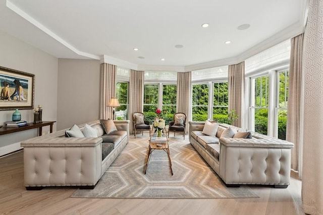 living room with light wood finished floors and recessed lighting