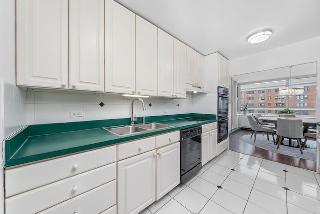 4250 N Marine Dr Unit 1622, Chicago, IL 60613 - kitchen with black appliances, a sink, and white cabinetry
