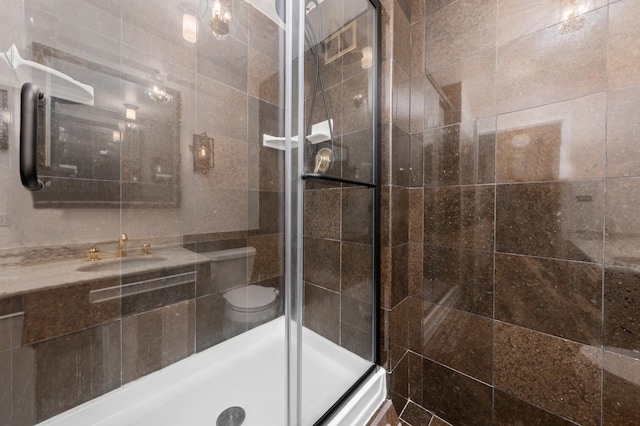 4250 N Marine Dr Unit 1622, Chicago, IL 60613 - bathroom with a sink, a shower stall, and toilet