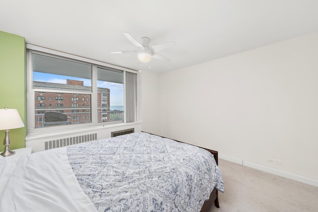 4250 N Marine Dr Unit 1622, Chicago, IL 60613 - bedroom with carpet, baseboards, radiator heating unit, and a ceiling fan