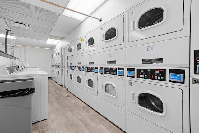 4250 N Marine Dr Unit 1622, Chicago, IL 60613 - shared laundry room with stacked washer / dryer, washer and clothes dryer, and light wood finished floors
