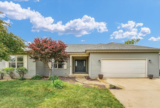 2302 Slade Ln, Mahomet, IL 61853 - view of front of property with a garage, driveway, and a front yard