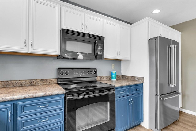 2302 Slade Ln, Mahomet, IL 61853 - kitchen with black appliances, blue cabinets, white cabinetry, light wood-style flooring, and recessed lighting