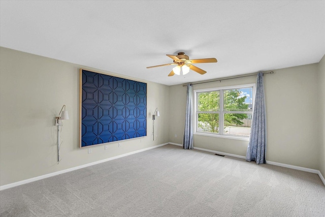 2302 Slade Ln, Mahomet, IL 61853 - carpeted empty room with a ceiling fan and baseboards