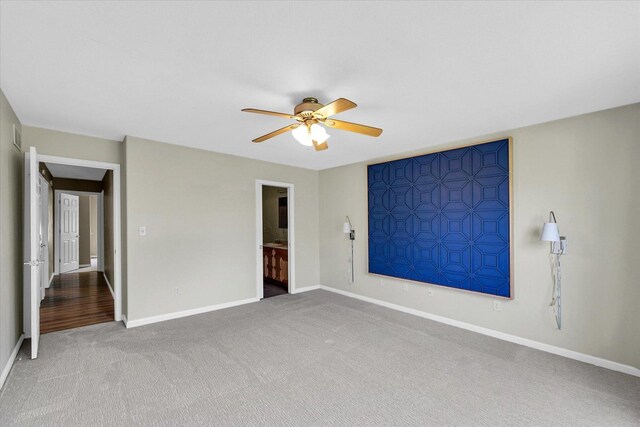 2302 Slade Ln, Mahomet, IL 61853 - unfurnished bedroom featuring carpet floors, a ceiling fan, and ensuite bath