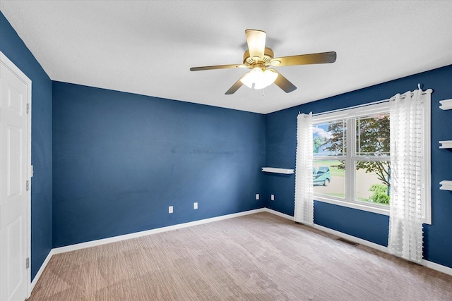 2302 Slade Ln, Mahomet, IL 61853 - empty room with a ceiling fan and carpet