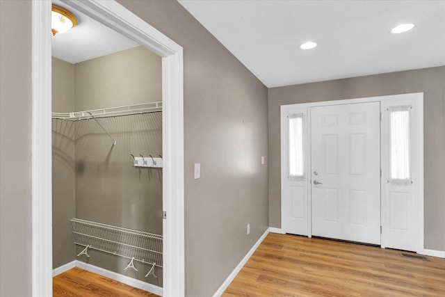 2302 Slade Ln, Mahomet, IL 61853 - foyer featuring plenty of natural light, wood finished floors, and recessed lighting