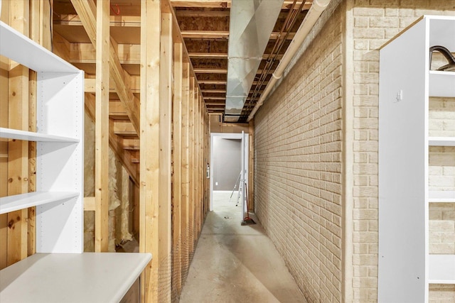 2302 Slade Ln, Mahomet, IL 61853 - basement featuring brick wall