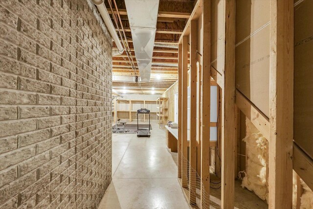 2302 Slade Ln, Mahomet, IL 61853 - corridor featuring brick wall