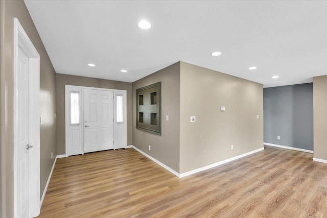 2302 Slade Ln, Mahomet, IL 61853 - entryway featuring light wood-style floors and recessed lighting