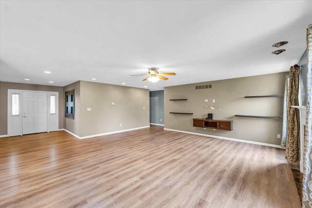 2302 Slade Ln, Mahomet, IL 61853 - unfurnished living room featuring a ceiling fan, light wood-type flooring, and recessed lighting