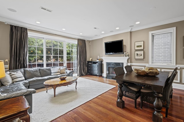 718 W Aldine Ave Unit 3, Chicago, IL 60657 - living room featuring ornamental molding, wood finished floors, a fireplace, and recessed lighting