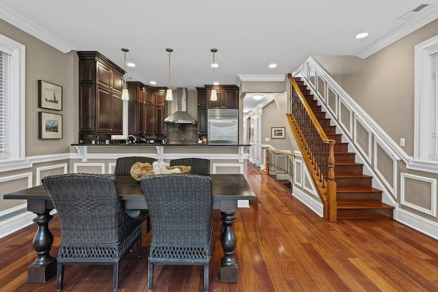 718 W Aldine Ave Unit 3, Chicago, IL 60657 - dining room featuring stairway, a decorative wall, ornamental molding, dark wood-style flooring, and recessed lighting