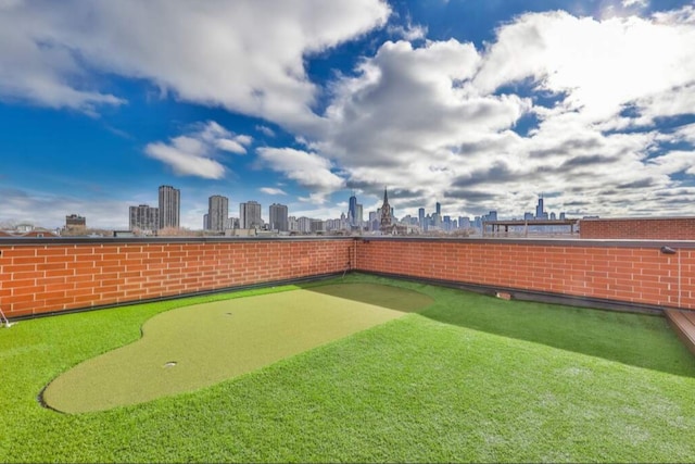 1827 N Larrabee St Unit 4, Chicago, IL 60614 - view of yard with a view of skyline and an area to practice putting