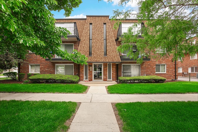 10701 S Keating Ave Unit 1C, Oak Lawn, IL 60453 - view of front facade featuring a front lawn and brick siding