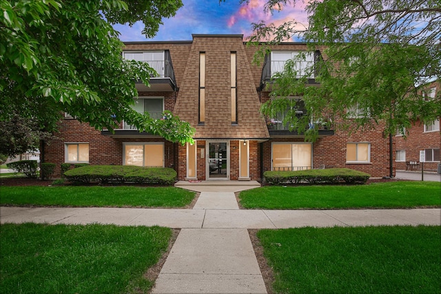 10701 S Keating Ave Unit 1C, Oak Lawn, IL 60453 - view of front of house featuring brick siding and a front yard