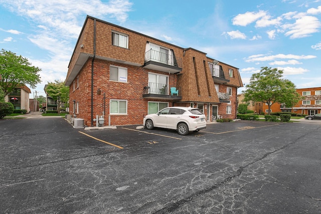 10701 S Keating Ave Unit 1C, Oak Lawn, IL 60453 - view of property with uncovered parking and cooling unit
