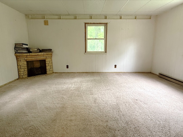12445 W Pacific Ave, Waukegan, IL 60085 - unfurnished living room with carpet, a fireplace, and baseboard heating