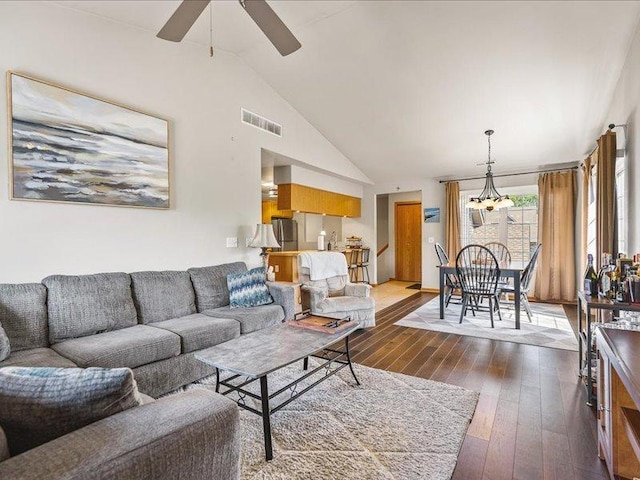 615 Queens Ct Unit 7, Rockton, IL 61072 - living room featuring a chandelier, a ceiling fan, lofted ceiling, and dark wood finished floors