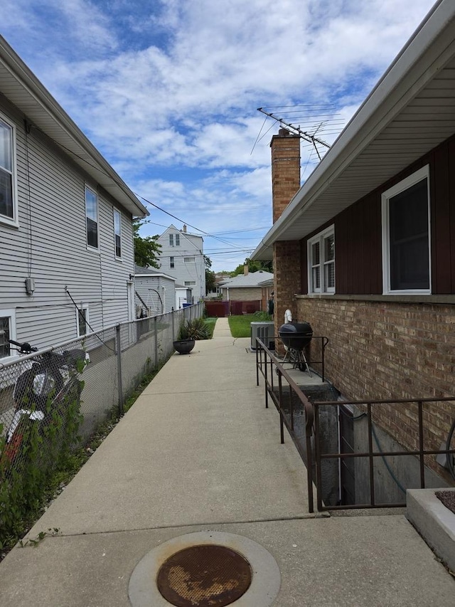 6124 W Berteau Ave, Chicago, IL 60634 - fenced backyard with a patio area, a grill, and cooling unit