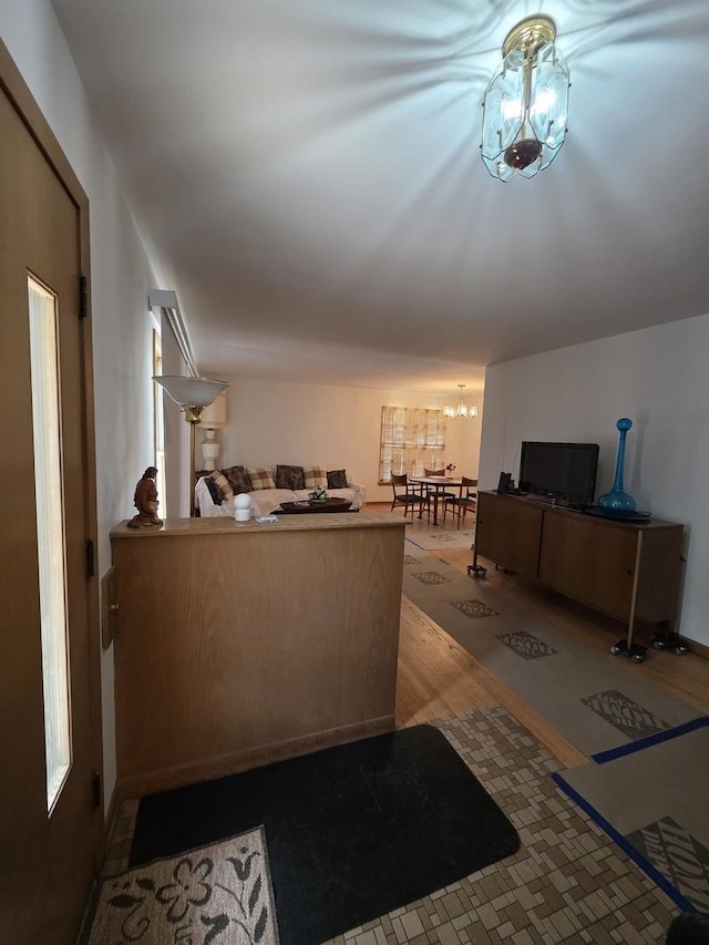 6124 W Berteau Ave, Chicago, IL 60634 - living area with a chandelier and wood finished floors