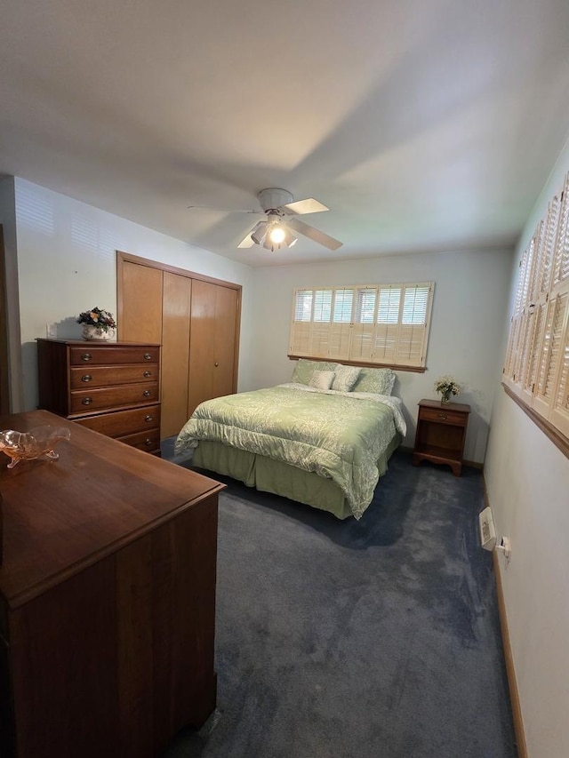 6124 W Berteau Ave, Chicago, IL 60634 - bedroom with dark colored carpet, ceiling fan, a closet, and baseboards
