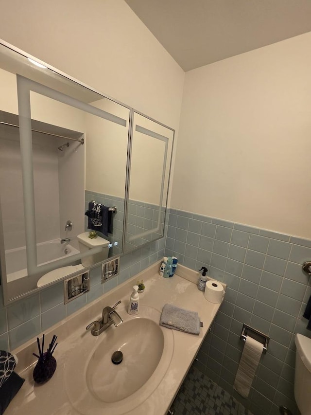 6124 W Berteau Ave, Chicago, IL 60634 - full bath with toilet, vanity, bathtub / shower combination, and tile walls