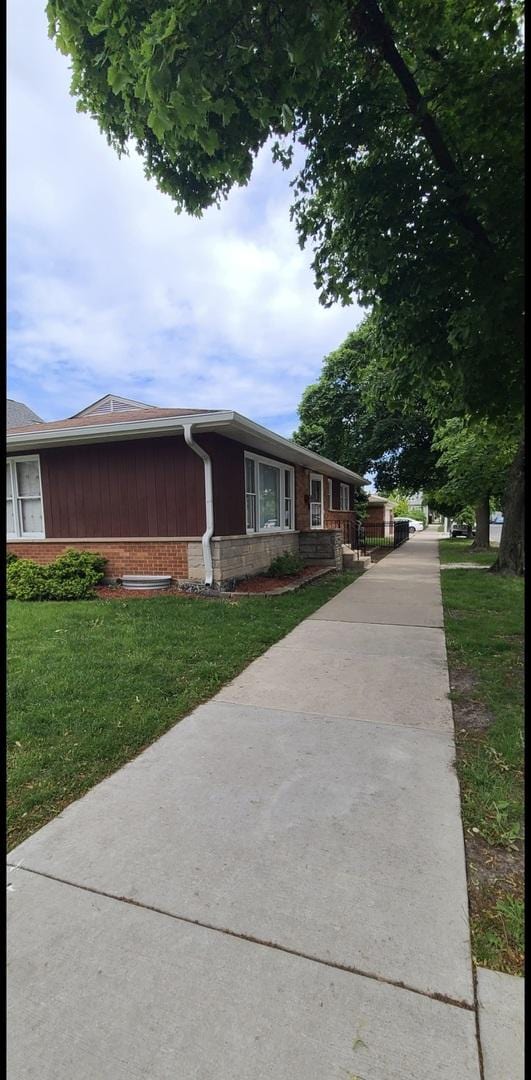 6124 W Berteau Ave, Chicago, IL 60634 - ranch-style home with brick siding and a front yard
