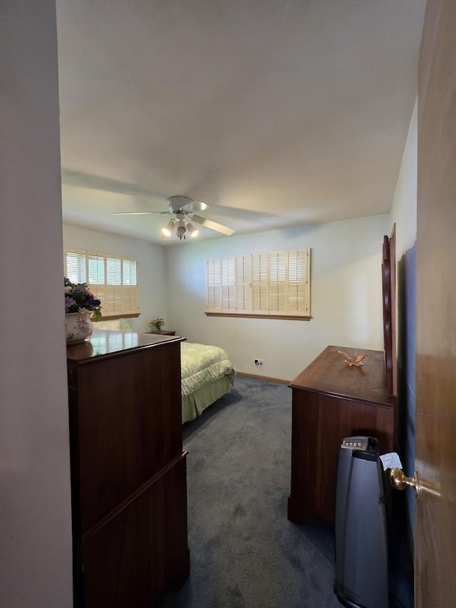 6124 W Berteau Ave, Chicago, IL 60634 - bedroom featuring dark colored carpet and ceiling fan