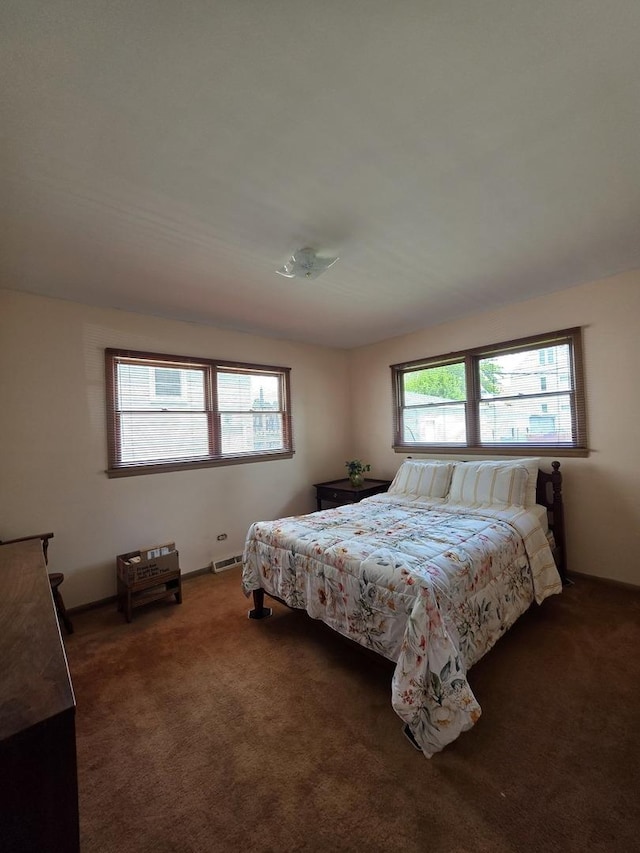 6124 W Berteau Ave, Chicago, IL 60634 - bedroom with multiple windows and carpet
