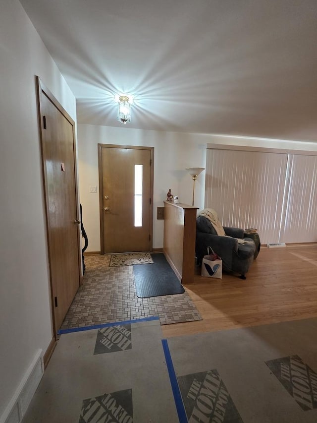 6124 W Berteau Ave, Chicago, IL 60634 - entryway with baseboards and wood finished floors